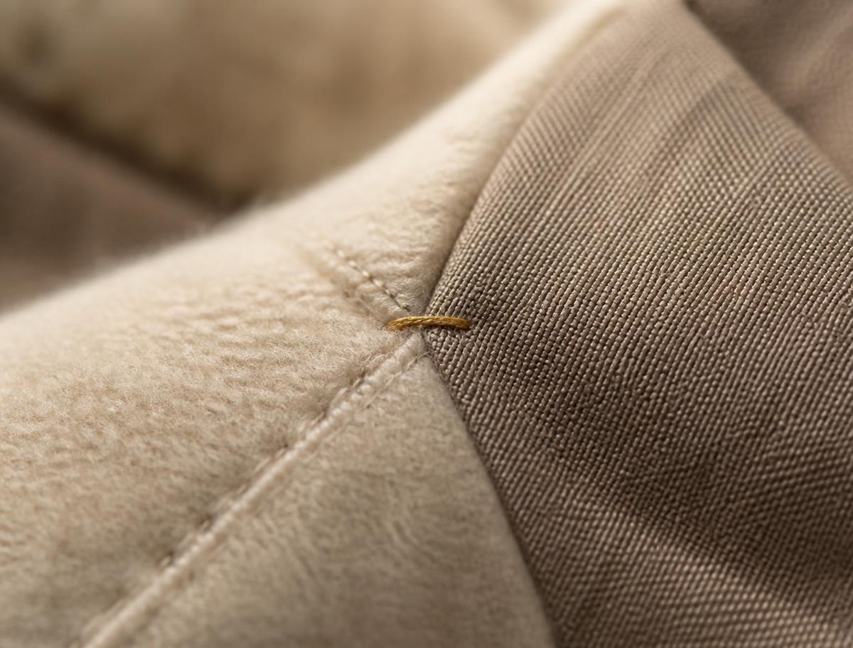 Macro detail of hand-finished seam construction